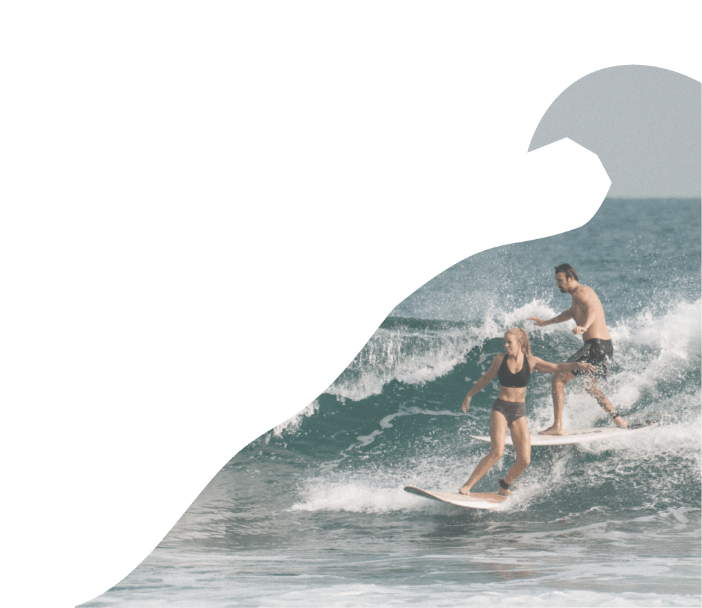 Two people surfing
